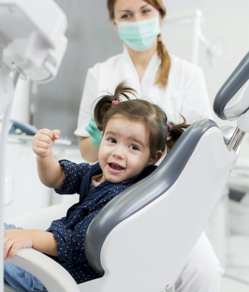 Young child smiling during first dental office visit