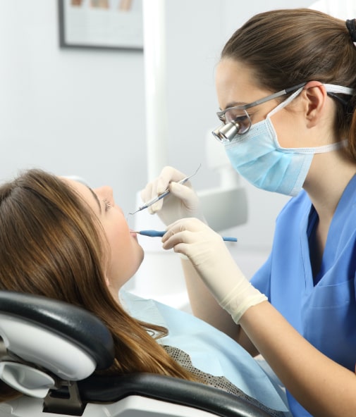 Dentist performing dental checkup and teeth cleaning