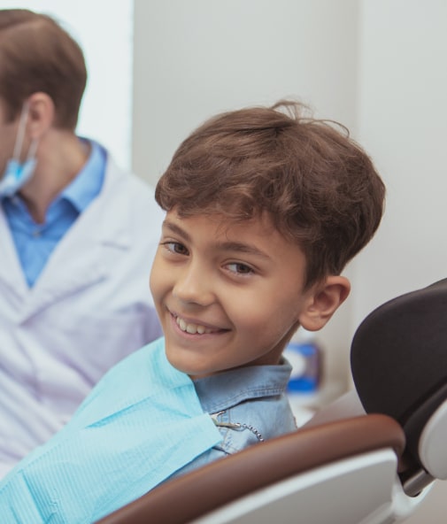 Child smiling after children's dentistry visit