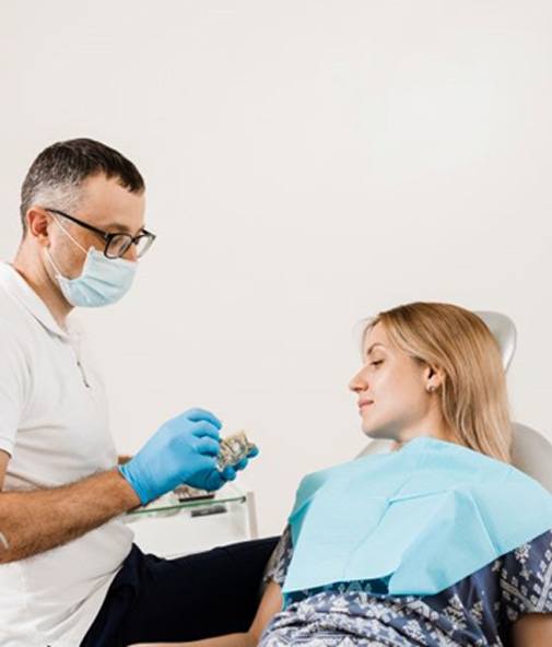 Dentist and patient discussing treatment options
