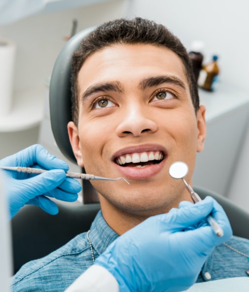 Man receiving covered dental treatment