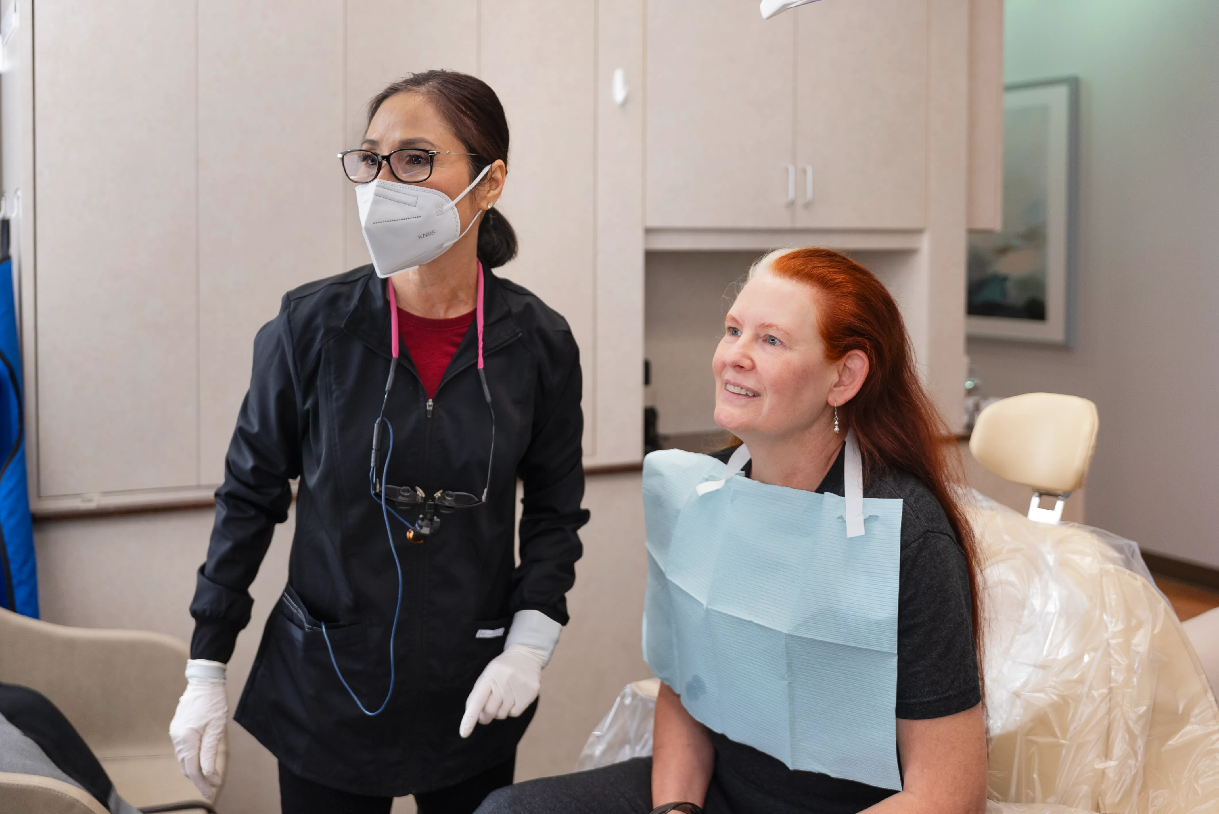Smiling woman visiting her emergency dentist in Los Gatos, CA