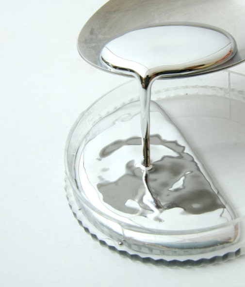 Liquified metal with ,ercury being poured